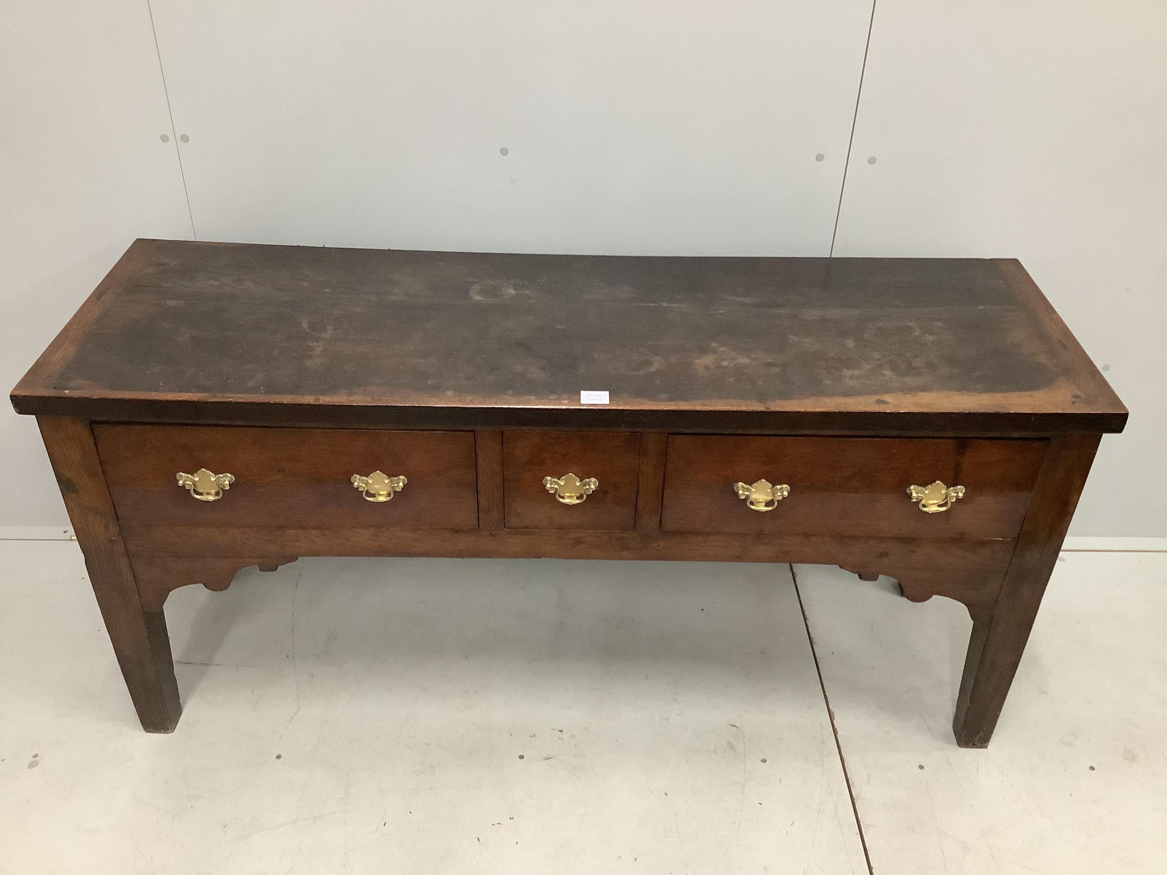 An 18th century style oak low dresser, width 157cm, depth 49cm, height 75cm. Condition - poor to fair